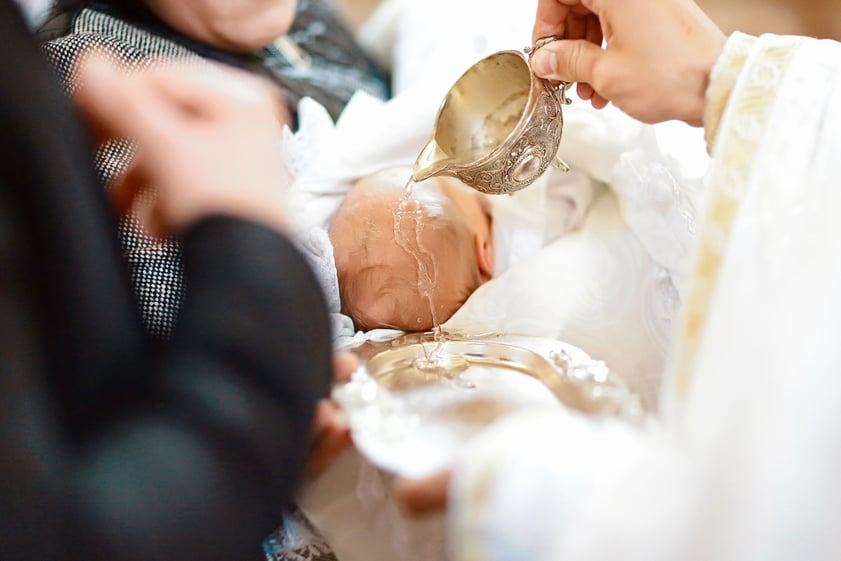 Infant being baptized