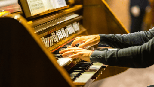 Church organist playing at service