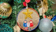 Handmade Christmas ornament with Mary, Joseph, and baby Jesus.