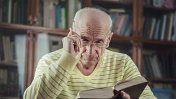 Elderly man seeks answers in reading his Bible