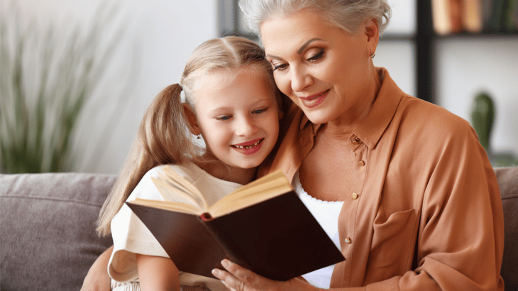 Grandmother teaching child the faith with Luther's Small Catechism