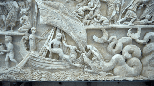 Stone carving of Jonah being thrown into the sea