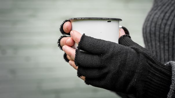 Person holding mug
