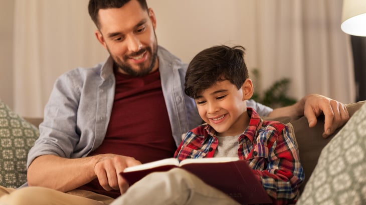 Father and son reading The Lutheran Study Bible from Concordia Publishing House