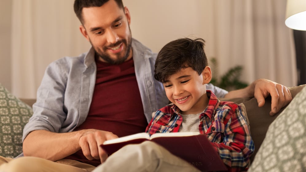 Father and son reading The Lutheran Study Bible from Concordia Publishing House