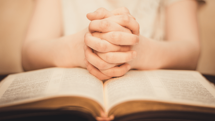 Hands folded in a spiritual habit of prayer 
