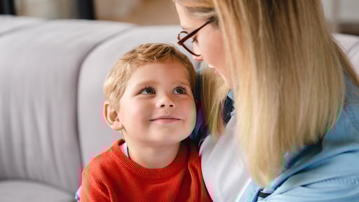 Young child looks at his mother lovingly
