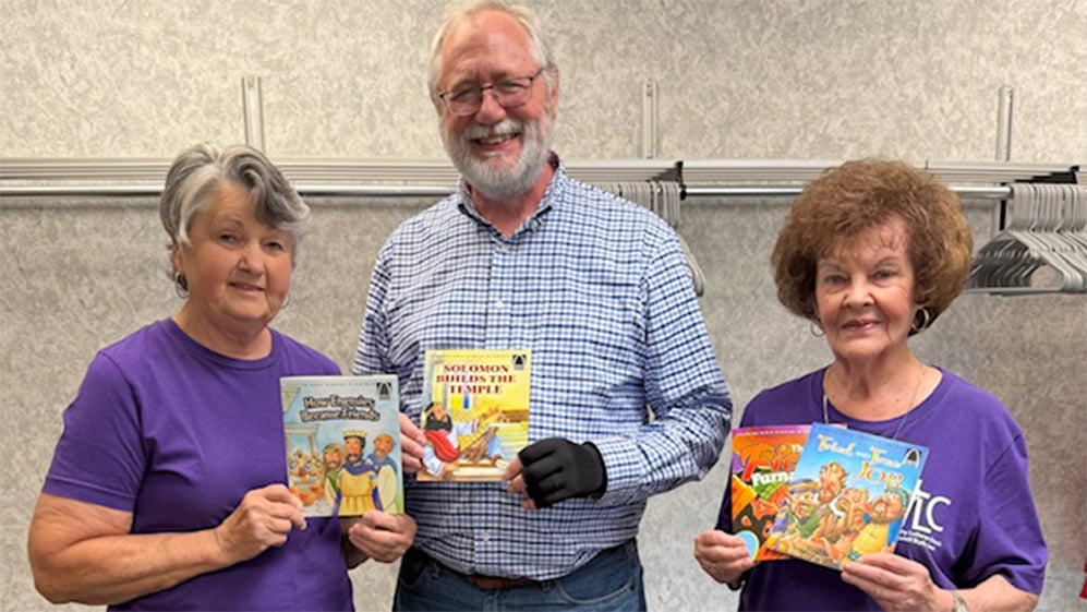 Volunteers and staff at a participating ministry in the CGO food bank Arch Book program