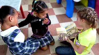 Children look at Arch Book from Concordia Publishing House