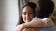 Wife hugging husband
