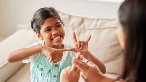 Mother and child communicating with sign language