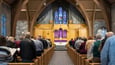 Church sanctuary full of members