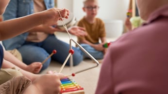 Family playing instruments worshiping God
