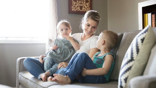 Mother sitting with her children lovingly