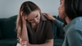 Woman comforting stressed friend 
