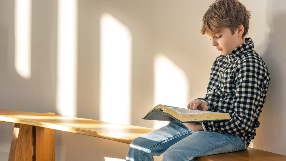 Boy reading Bible 