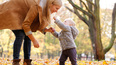 Mother and toddler outside autumn