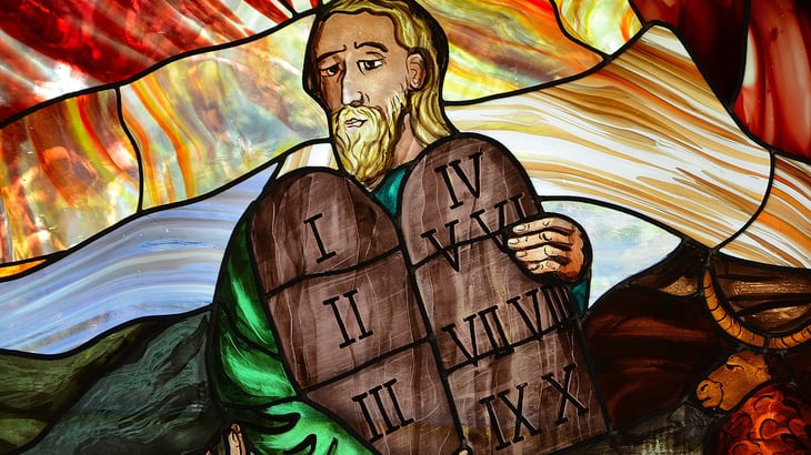 Moses holding ten commandments stained glass
