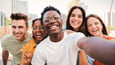 Group of young adults smiling together