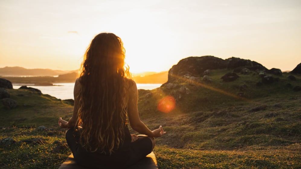 Woman practicing new age beliefs