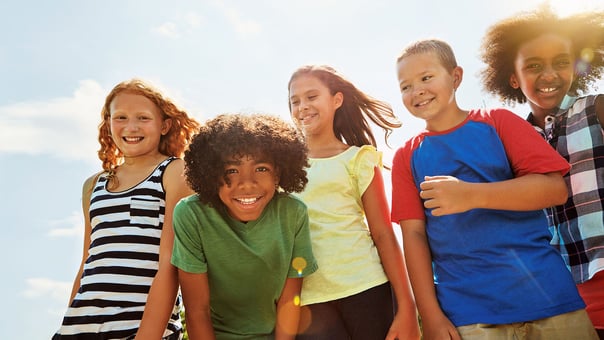 Preteen children smiling together