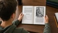 Preteen boy reading Journey Through Church History
