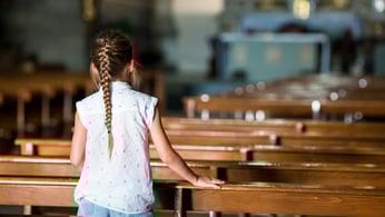 Young girl in church sanctuary